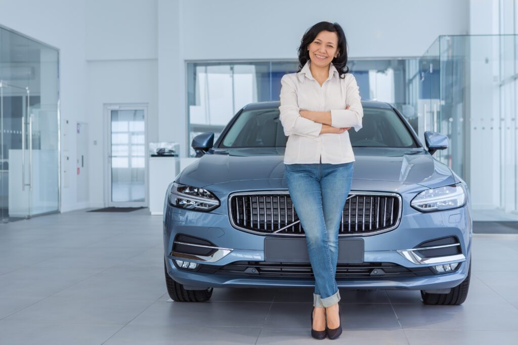 Woman Smiling Posing Near Her Automobile